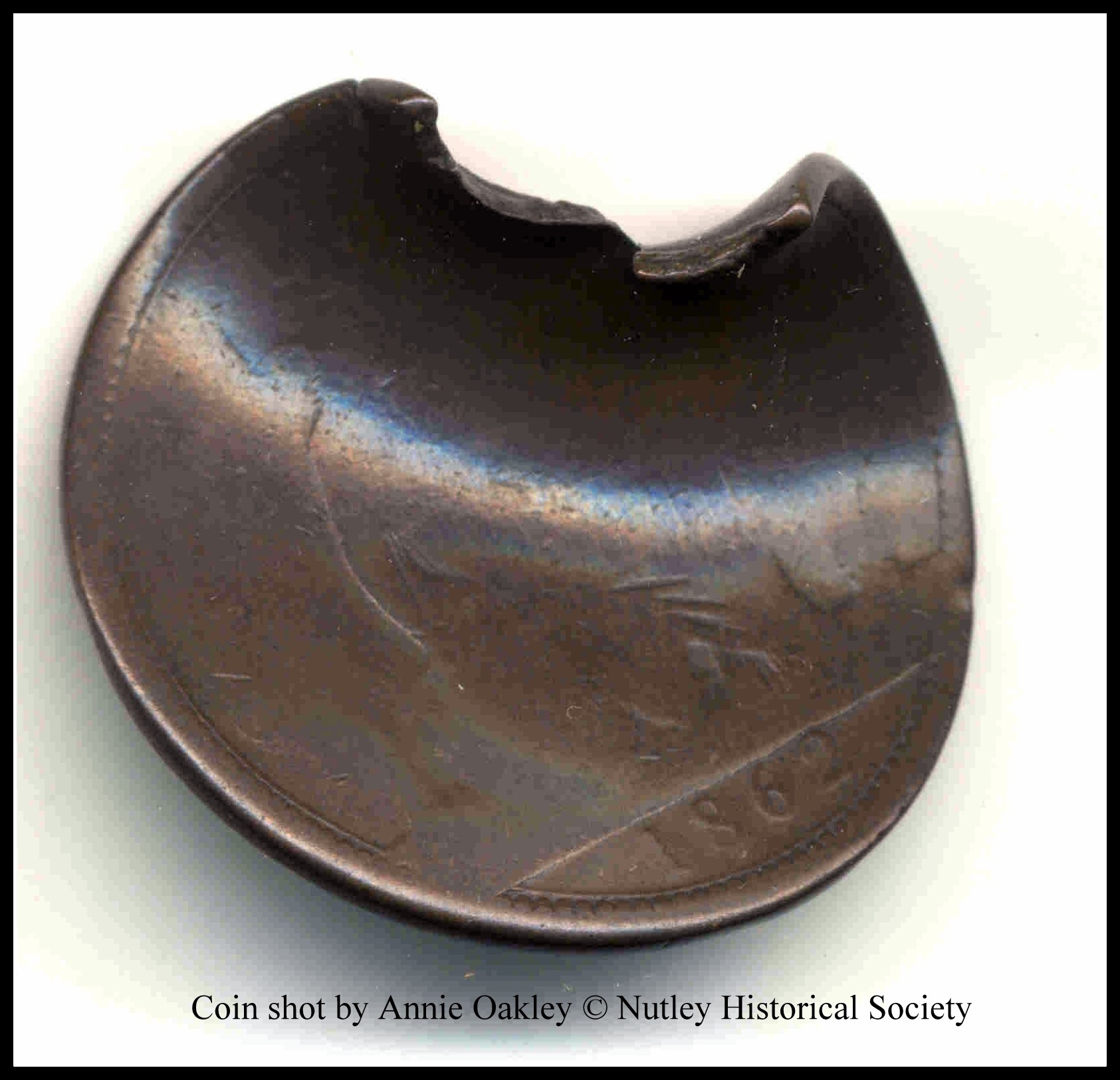 Nutley NJ Museum Exhibit: Coin shot in mid-air by Annie Oakley